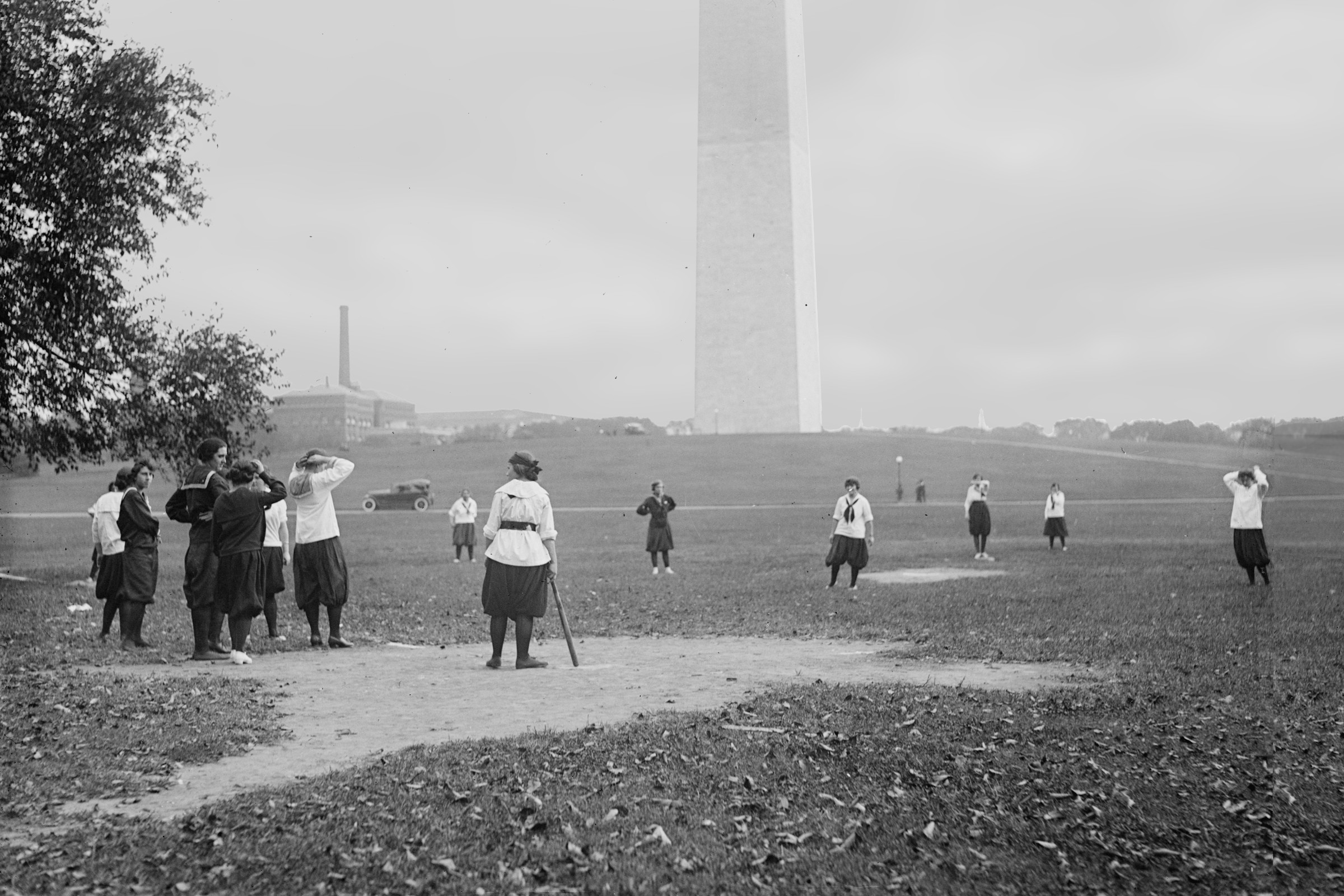 Women playing baseball by the Washington Monument, October 1919