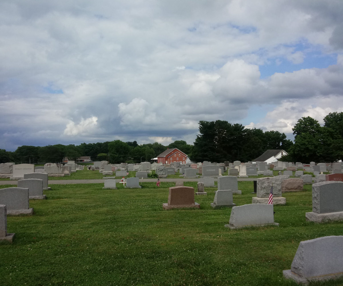 Looking back toward the Mennonite Church from deep in the cemetery