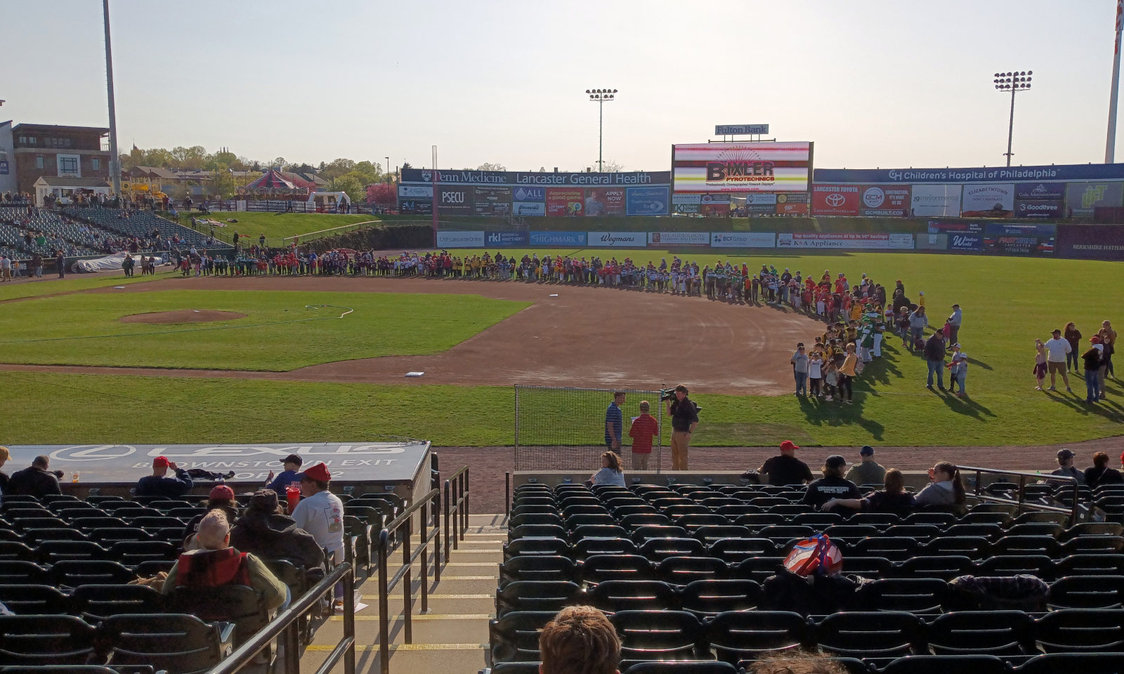 Kids ringing the infield pre-game -- and pre-hosing!