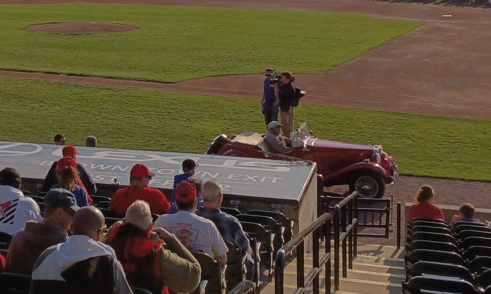 A classic car, after dropping off a player at the Barnstormers' dugout