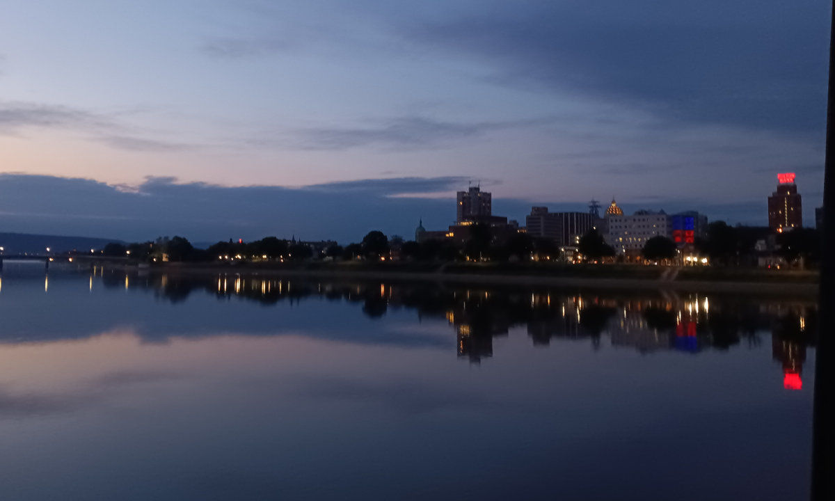 Downtown Harrisburg reflecting in the still waters of the Susquehanna after sunset