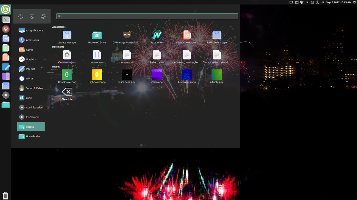 Screenshot of my Linux Mint install, showing the transparent Unity-styled Cinnamenu.