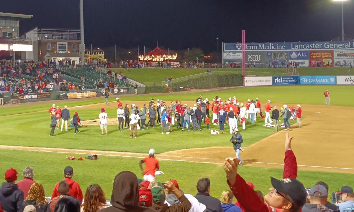 The Barnstormers celebrate on the field after their victory, and their fans celebrate along with them.