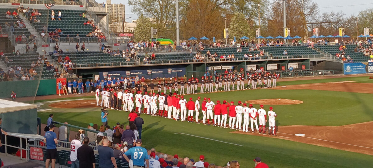 Both teams lined up along the base lines during pre-game ceremonies