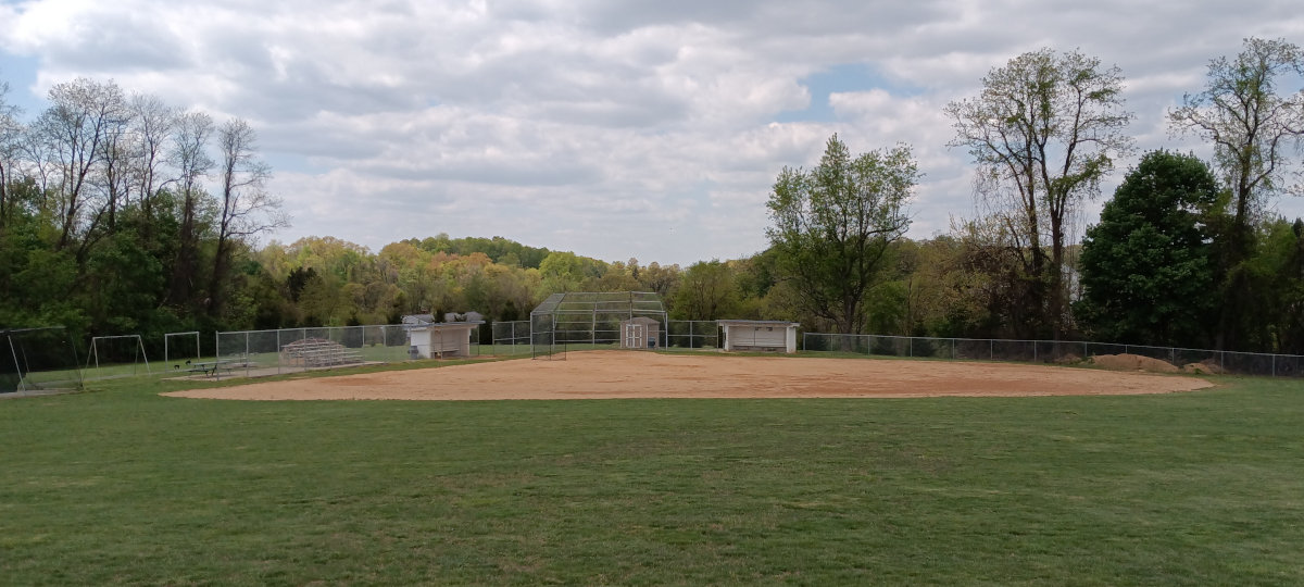 A town park ballfield, nestled among the trees
