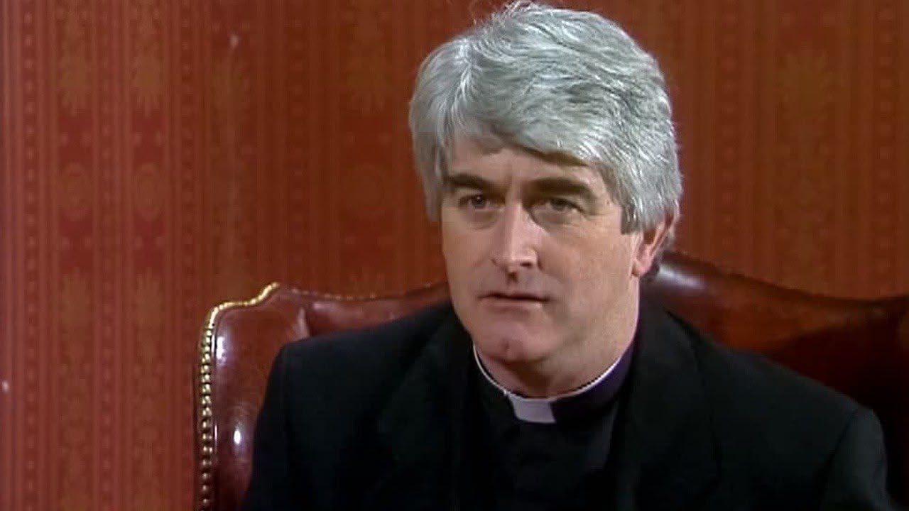 Dermot Morgan as Father Ted Crilly, from the sitcom Father Ted