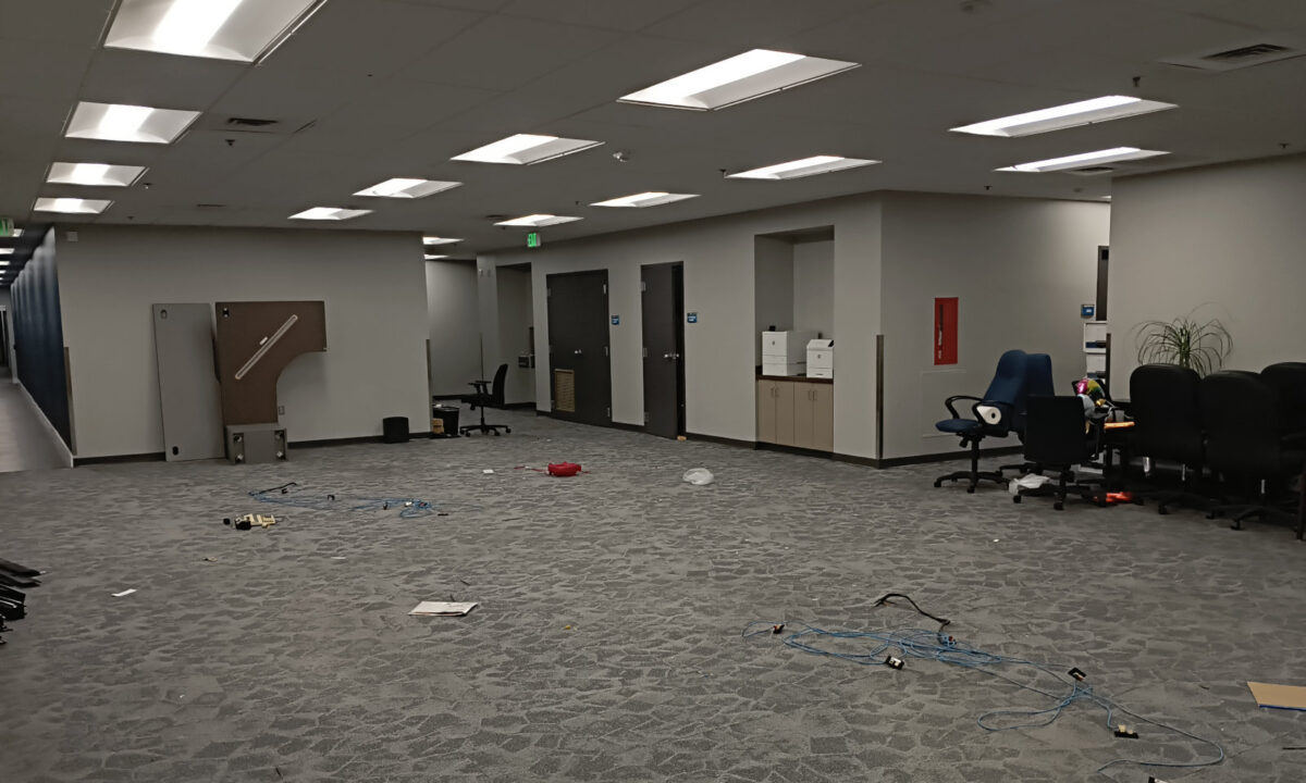 A vast (and messy) carpeted area in Diamond's offices, where once several cubicle blocks stood.