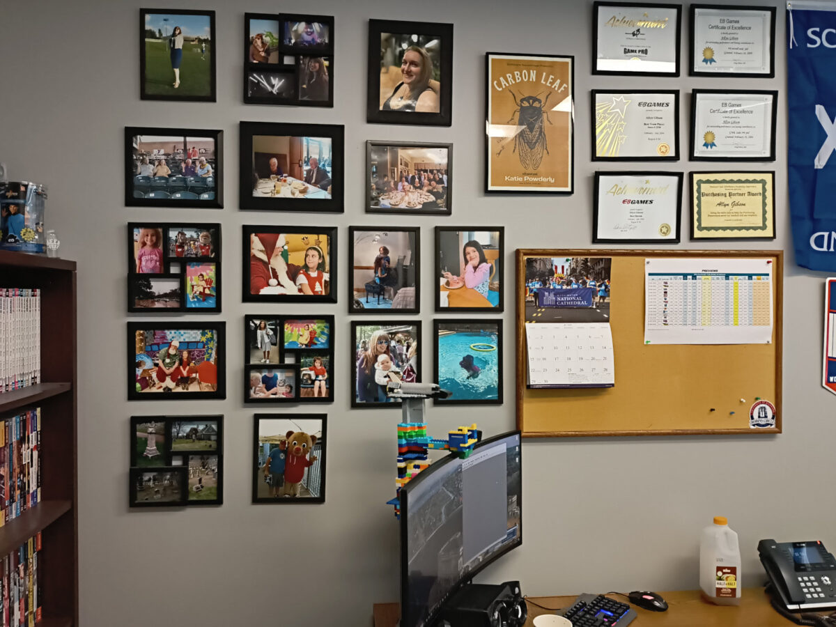 The wall of my office, before I denuded it of photos, artwork, and awards. At left is my PREVIEWS library.