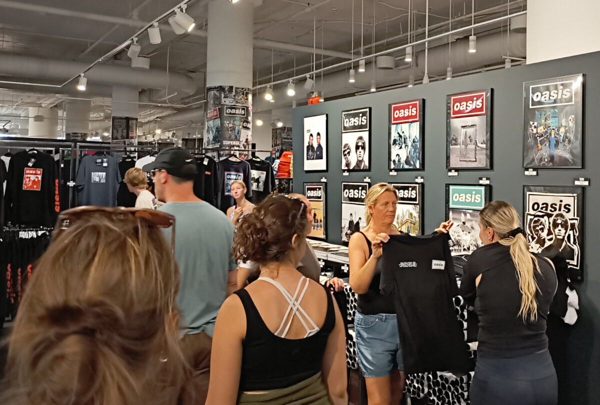 The interior of the Oasis pop-up shop. They had t-shirts, bucket hats, puzzles, exclusive vinyl, posters, and some other tchotkes.