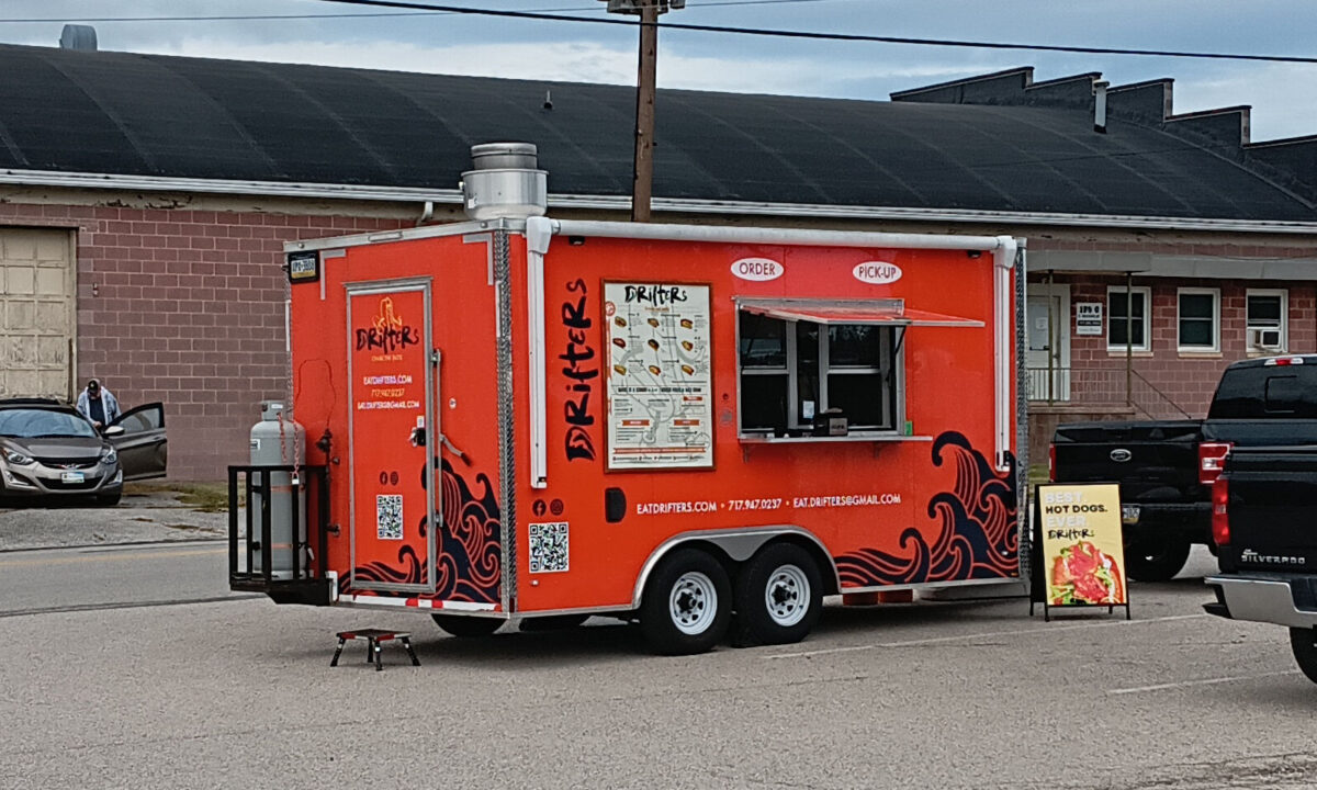 A food truck, selling hot dogs!