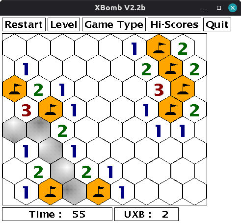 Screenshot of xbomb, playing a game in its hex grid form. I have most of the bombs located, and need to find two more. The screen is very white and not pleasant to look at.