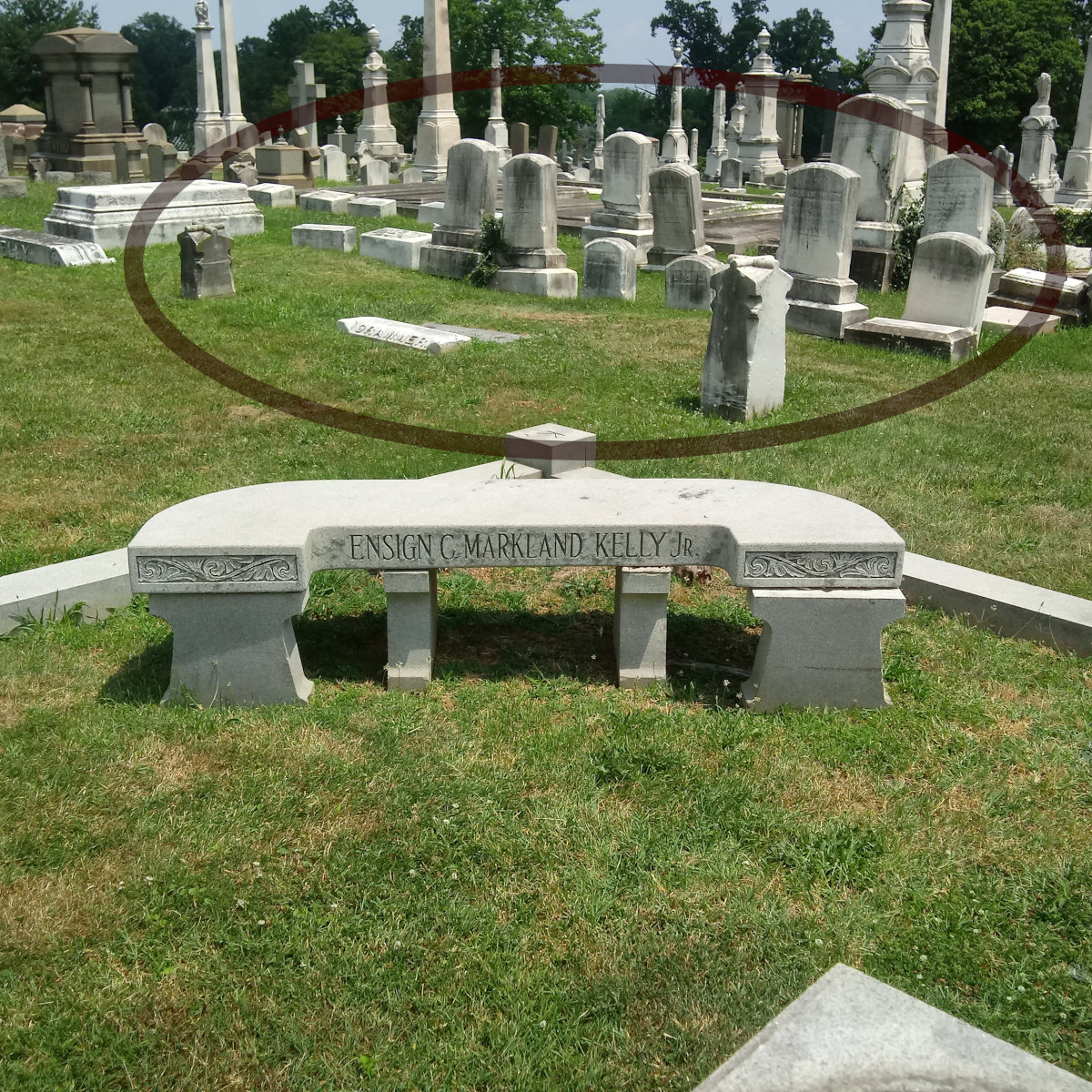 The memorial to Esn. Kelly, with the Grammer family plot in the background