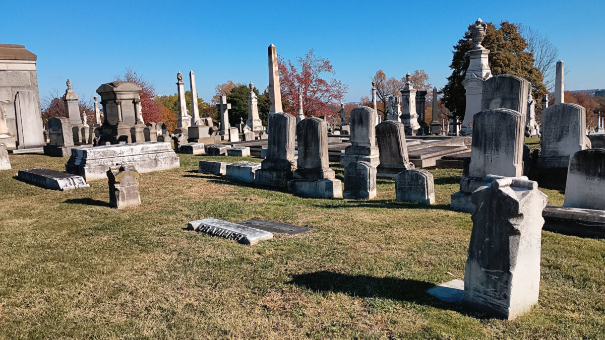 The Grammer family plot at Loudon Park cemetery, with markers at the corners, a slab that says 'Grammer,' and several unreadable headstones