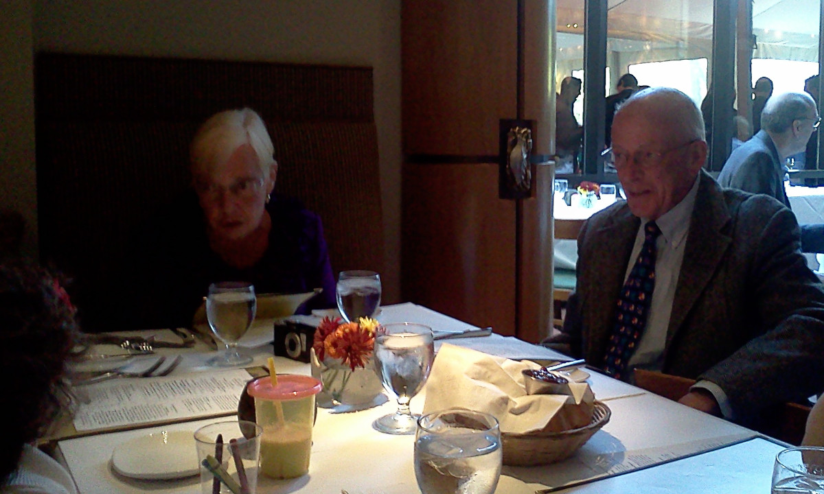My dad and mom, talking to my almost three-year-old niece, at my dad's 70th's birthday lunch. October 2011.