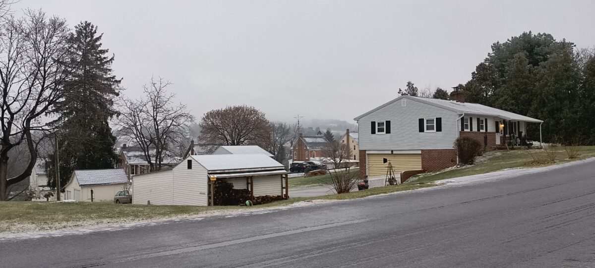 Yoe, covered in snow and slush, the watchtower in the distance lost in the gray clouds hanging over everything