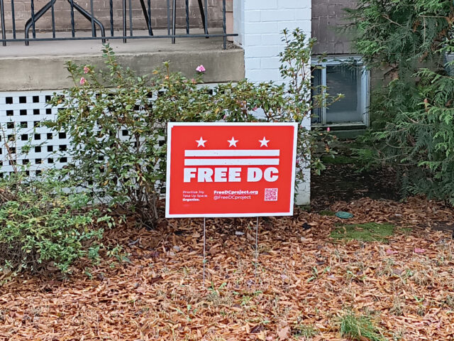 A sign in a yard that reads "Free DC"