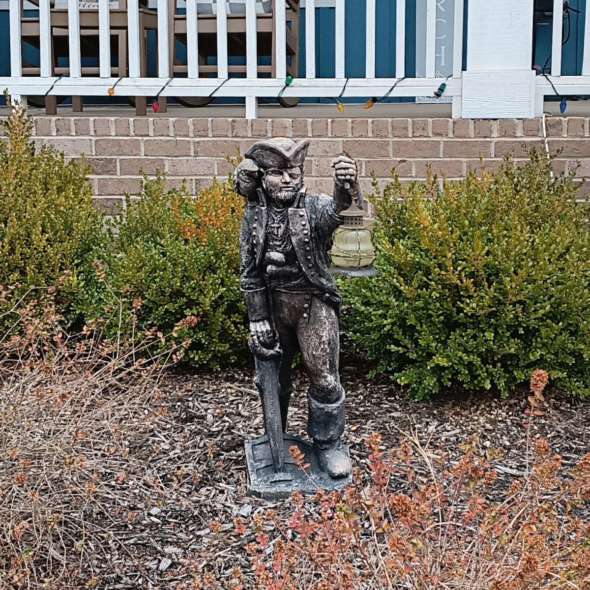 A lawn statue of a one-eyed pirate. Ahoy, mateys!