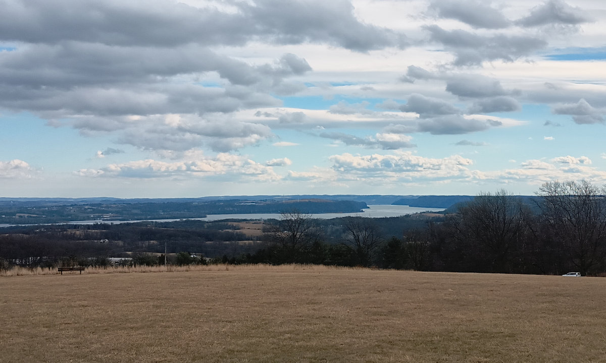 Looking south down the Susquehanna, with the sky broken up by clouds