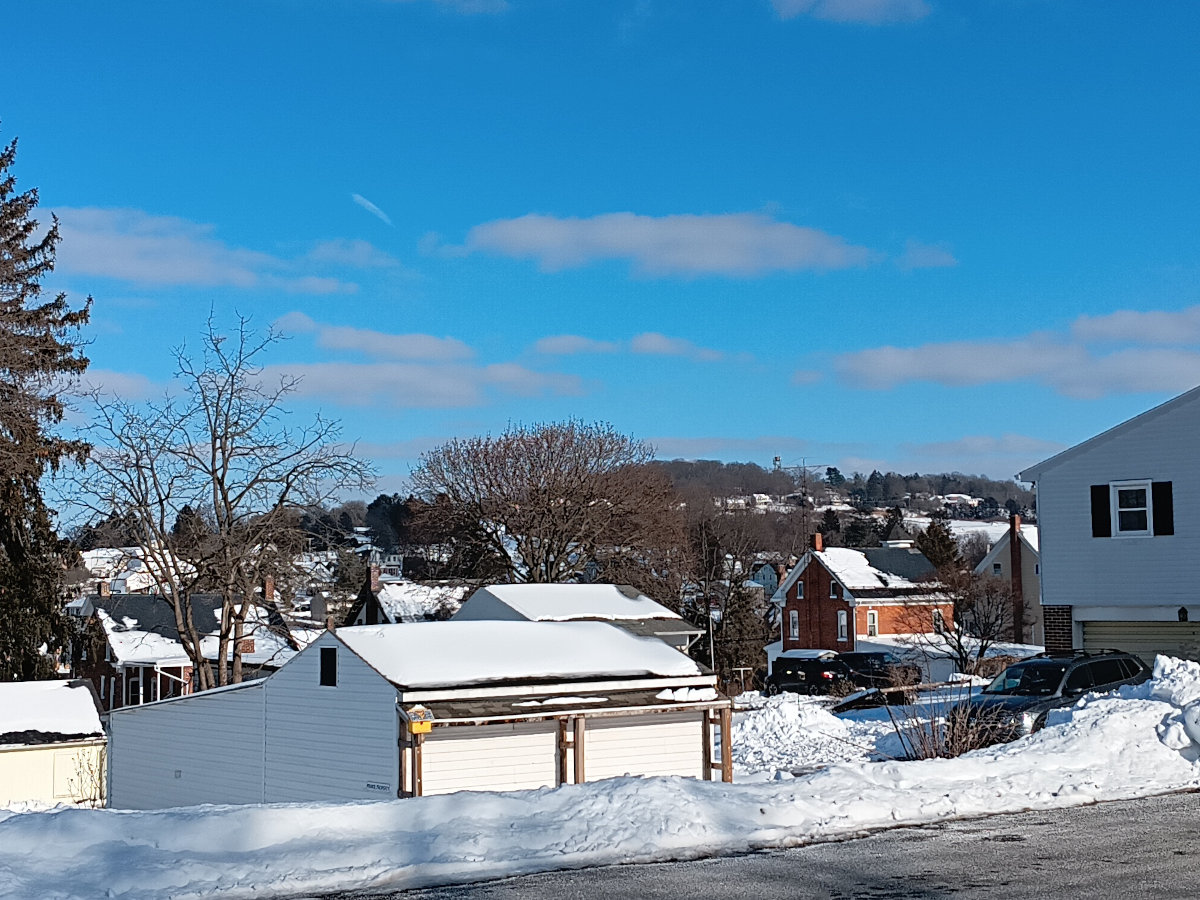 Looking out across Yoe to the firetower in Windsor, blue skies and everything covered in snow and ice