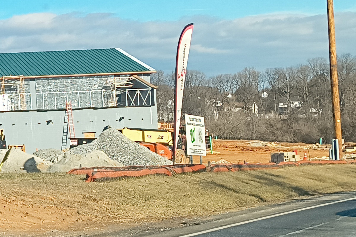 Construction site for a Windsor Township facility, with a green Curly W on the sign out front