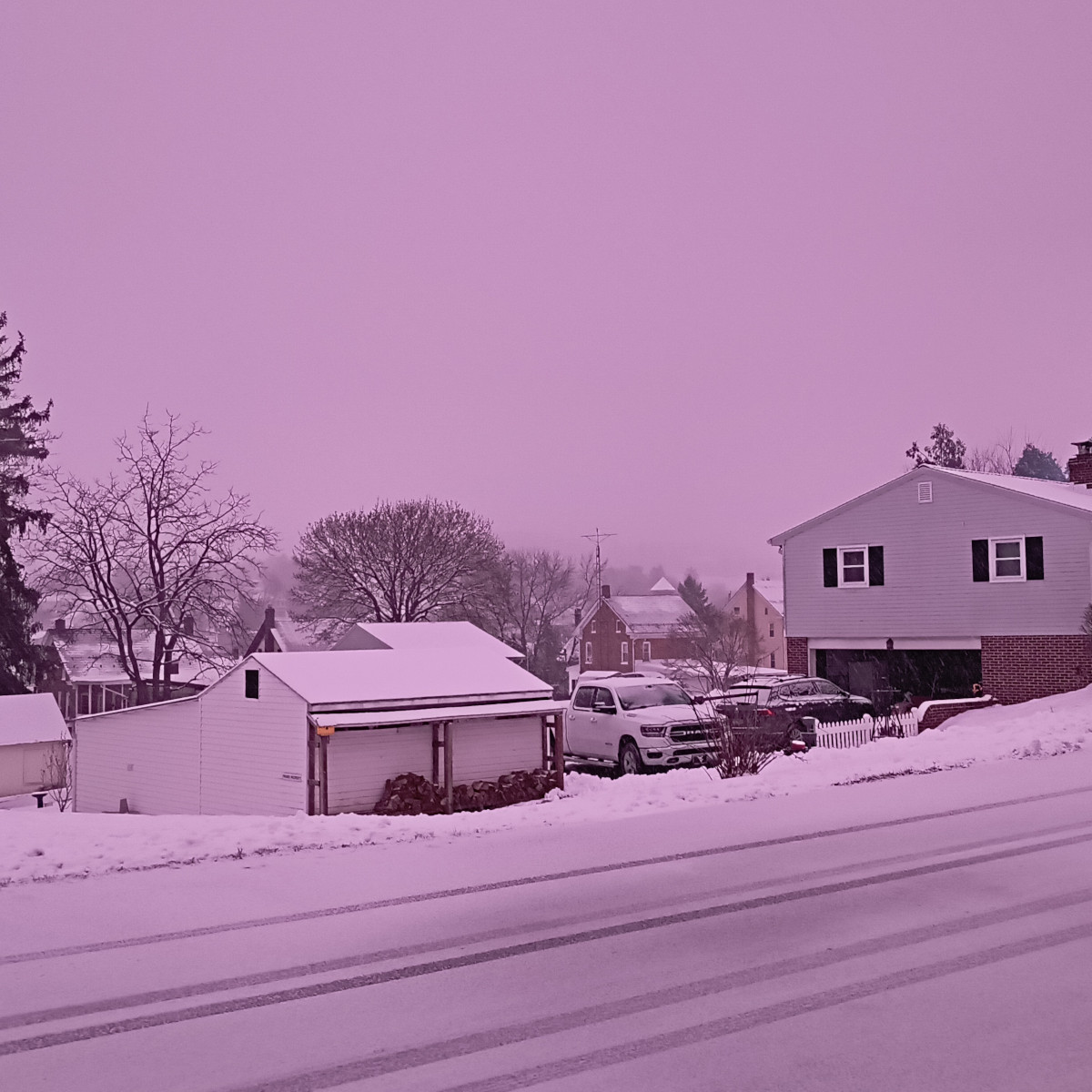 The snow is heavy enough that the hill in Red Lion and the watchtower beyond all lost in the skies