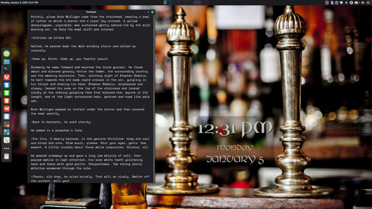 Screenshot of my desktop wallpaper, showing the counter of a Dublin pub and a window open with the first page of Ulysses in an ebook reader