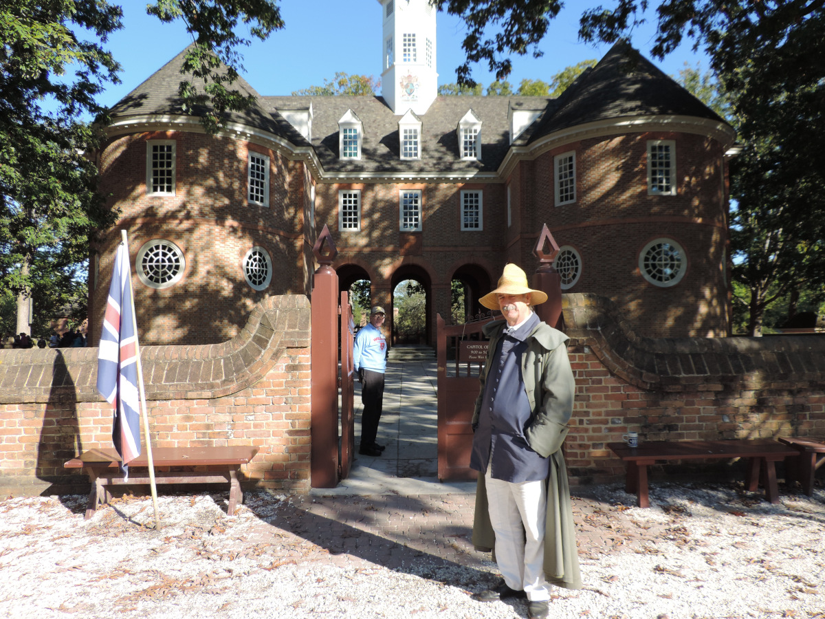 My dad, outside the Capitol at Colonial Williamsburg. He's the one in the back, inside the gate.