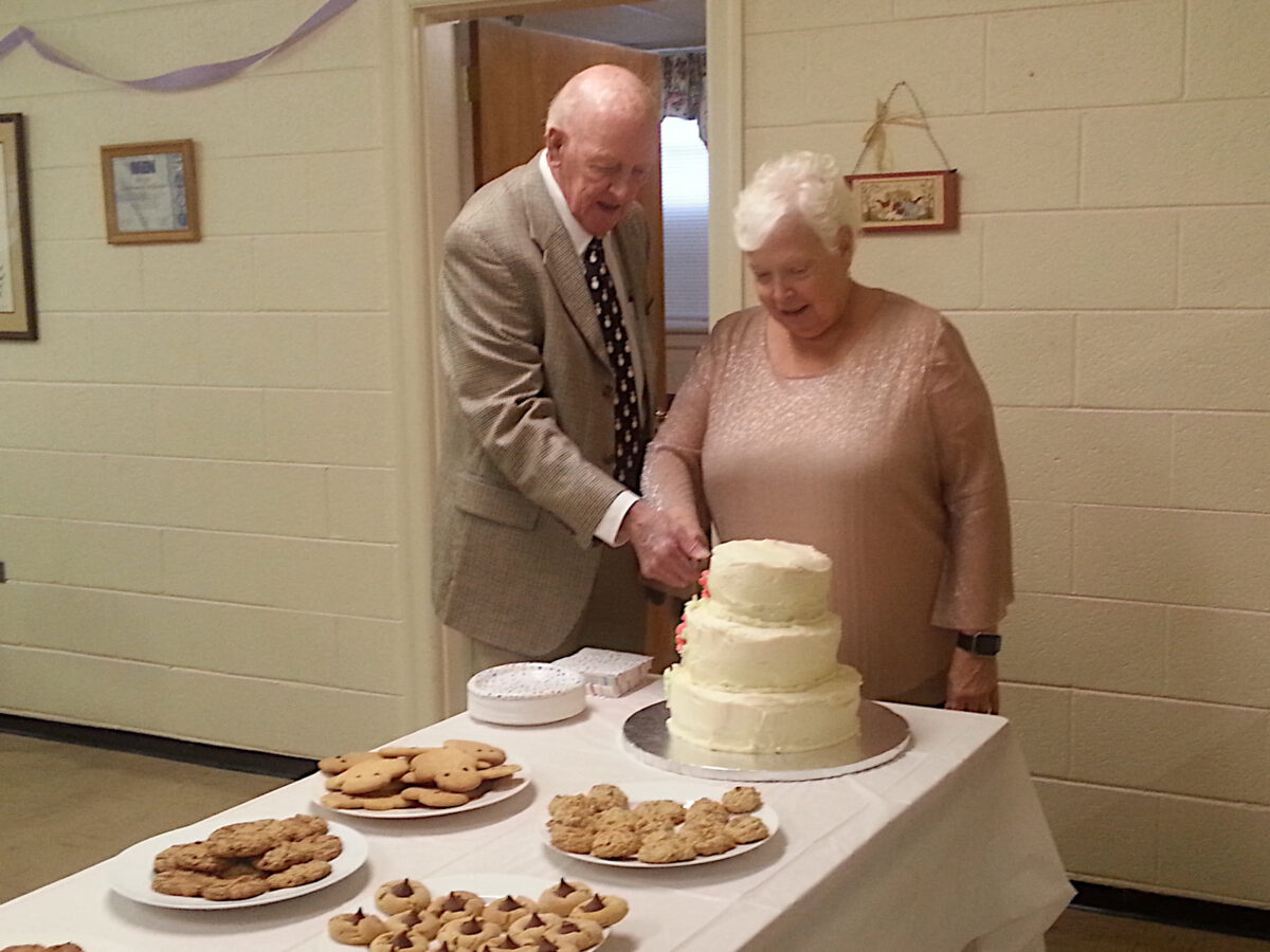 My mom and dad cutting a cake at their 45th-wedding anniversary party in 2017 in the basement of Monroe United Methodist Church. I took a lot of photos with my phone, and I promised my mom I would print them out and give them to her, and I never did. I've only looked at these a handful of times since.